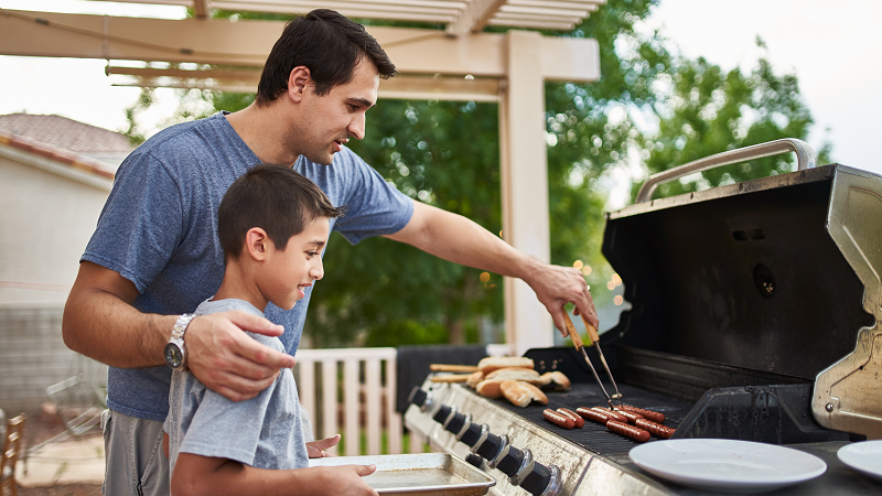 Father and son barbecuing